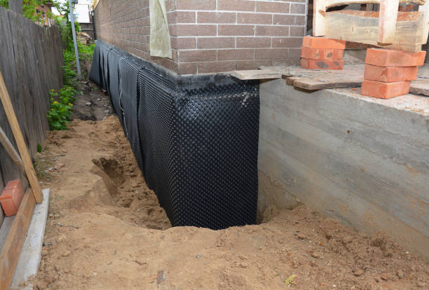 Happy homeowners after waterproofing job in Harmony